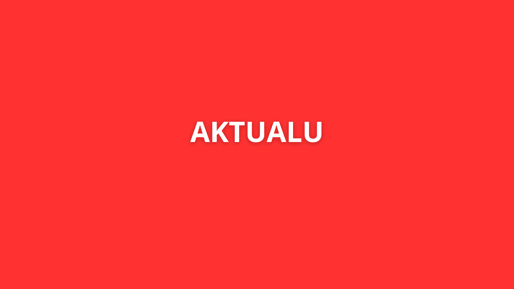 Baltas tekstas „AKTUALU“ yra centre ant vientisos ryškiai raudonos spalvos fono.